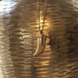 Long gold curved tooth pendant necklace